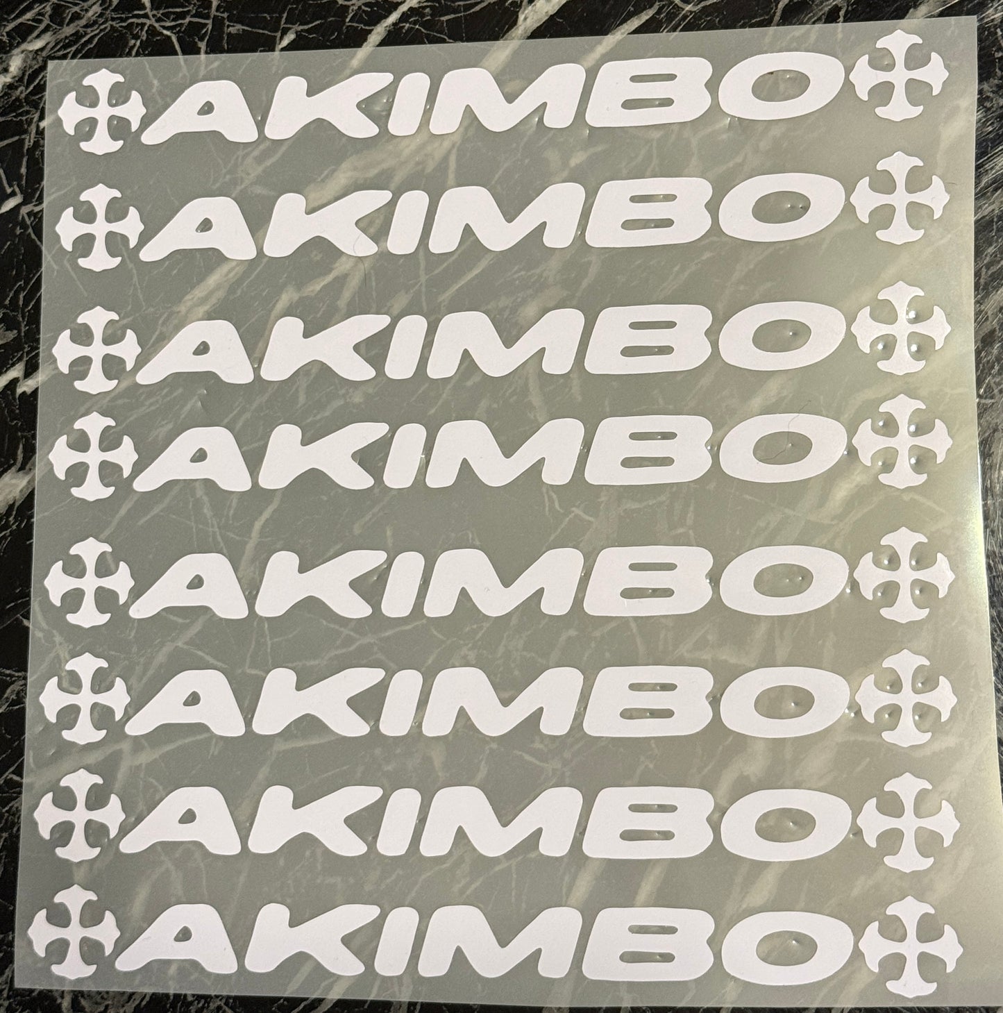Akimbo cross sticker
